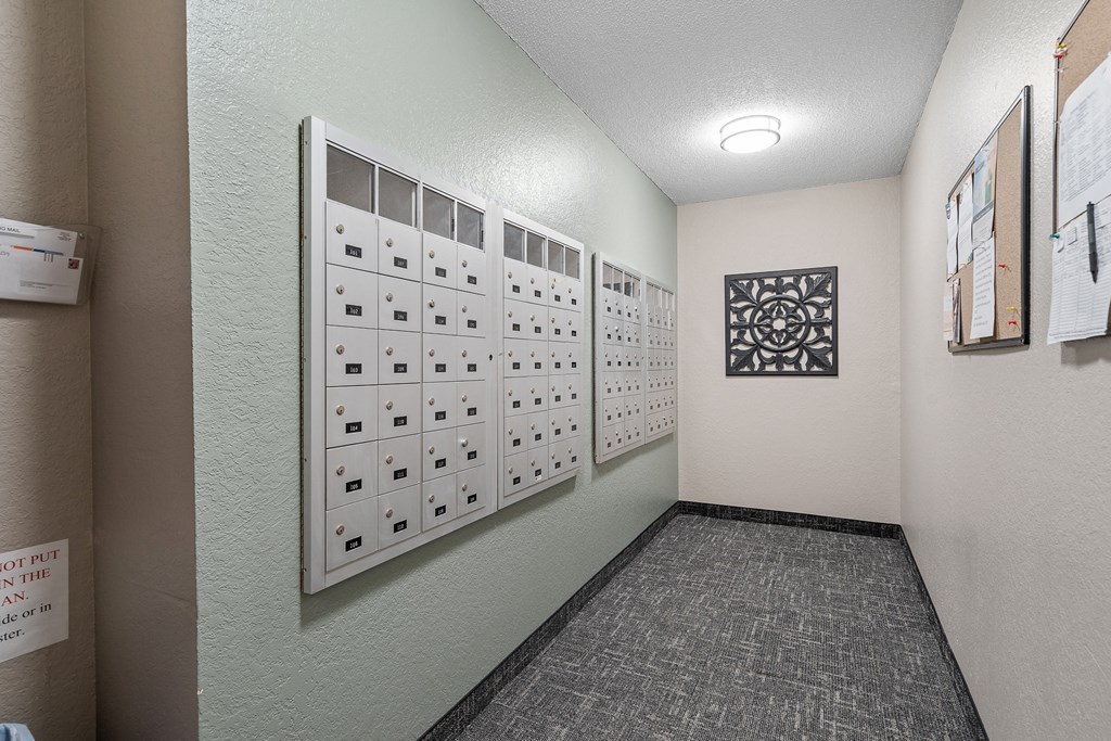 a utility room with a wall of mailboxes