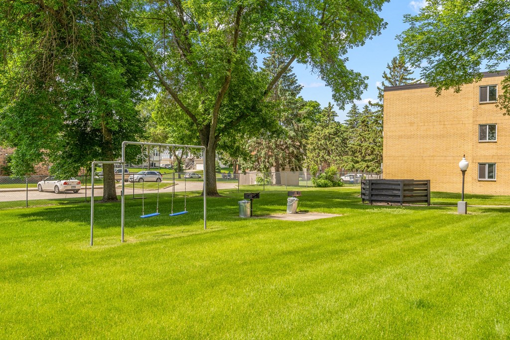 a park with a net in front of a building
