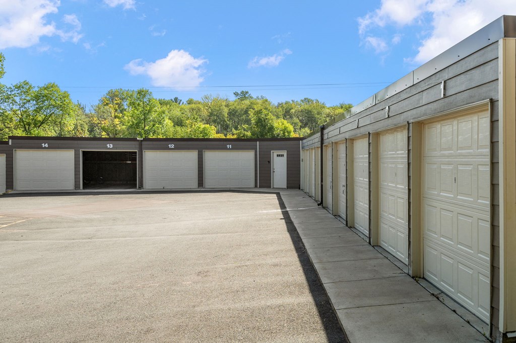 a row of storage units in a building with doors