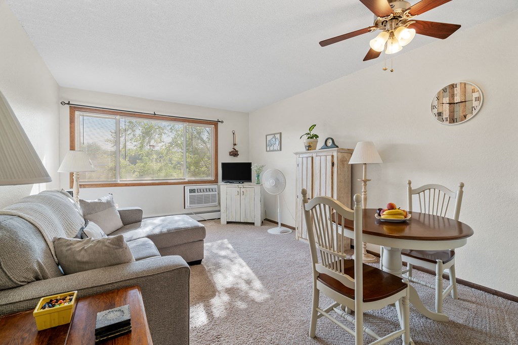 the living room and dining room with a couch and a table