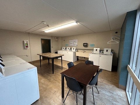 a dining room with a table and chairs