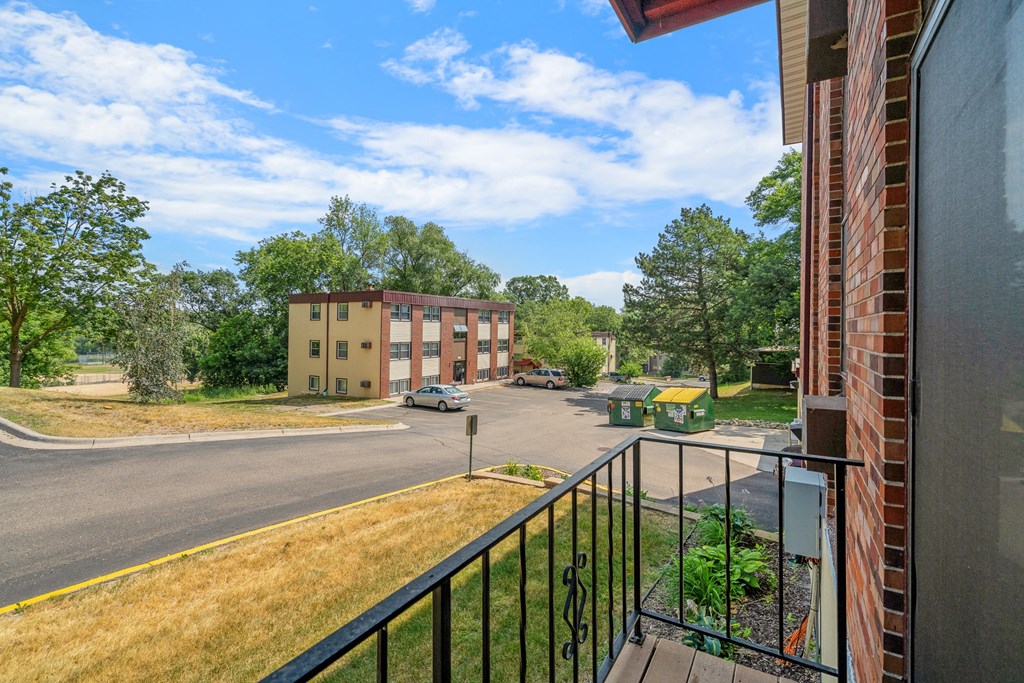 the view from the balcony of an apartment building on a sunny day