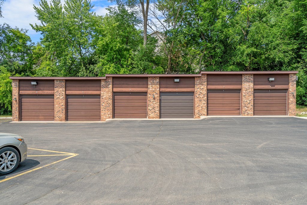 a row of garage doors in a parking lot
