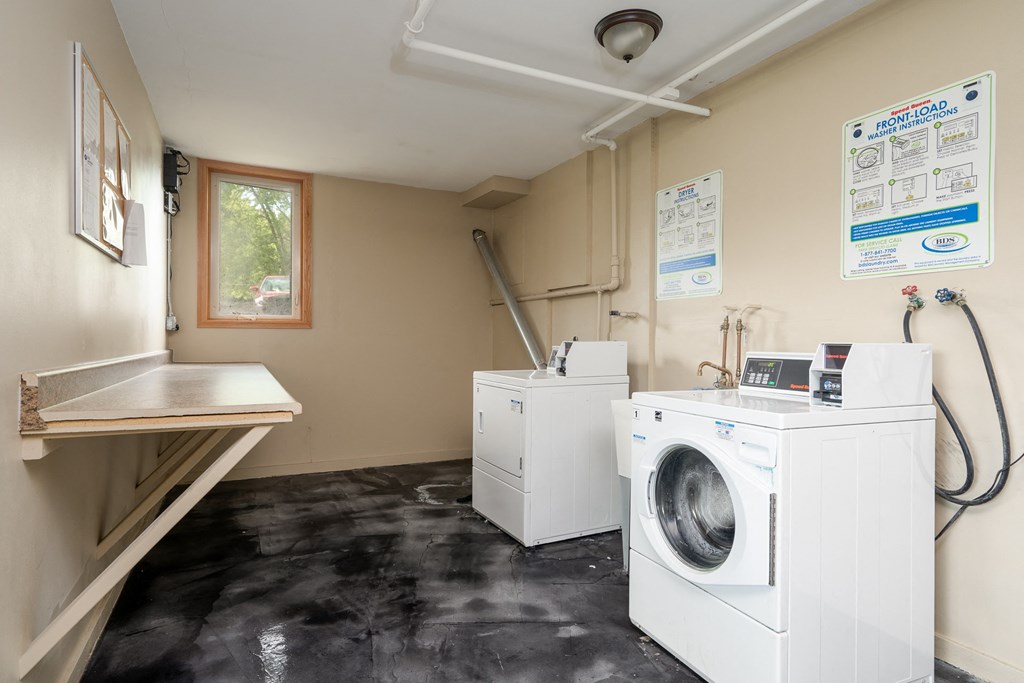 a laundry room with a washing machine and a dryer