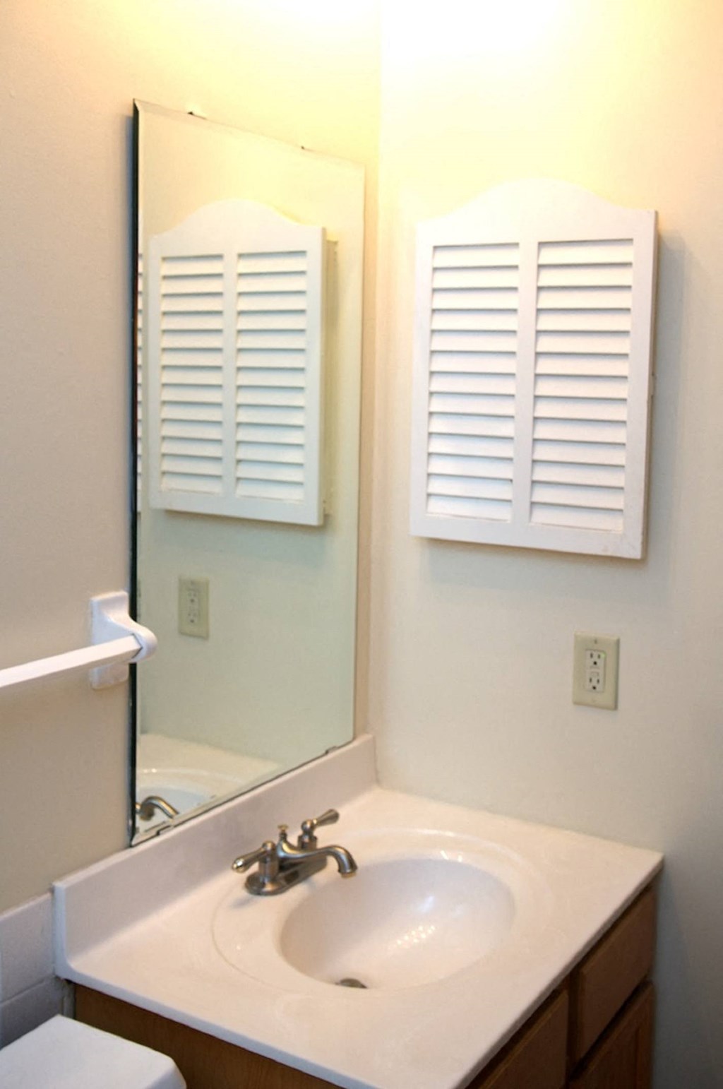a small bathroom with a sink and a mirror