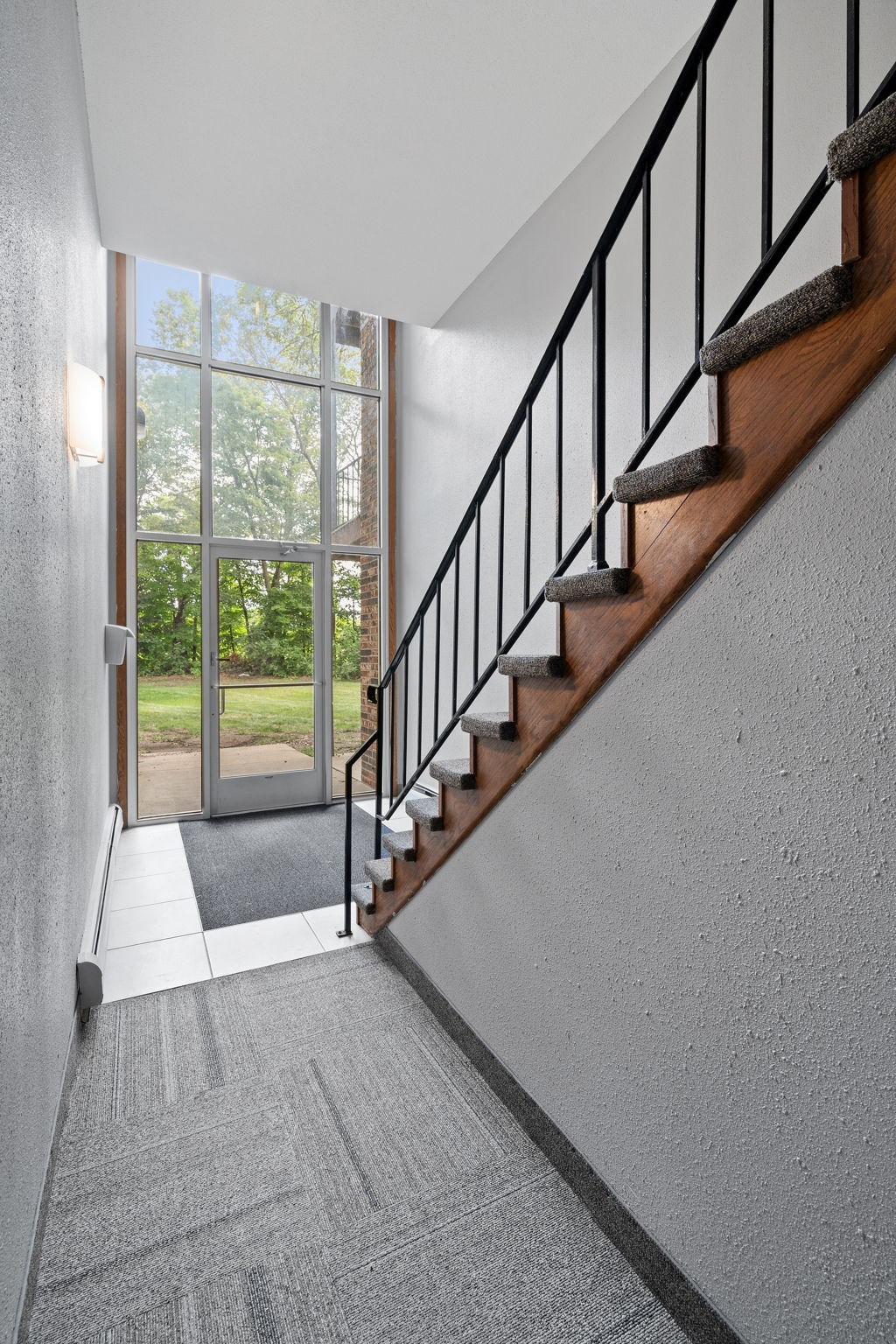 a staircase in a house with a glass door
