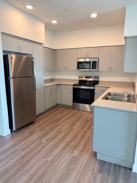 Apartment kitchen — representative home at Revive 25 Apartments.