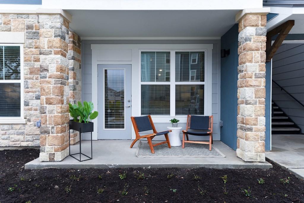 a patio with chairs and a table on a porch at Estraya Boerne, Boerne, TX