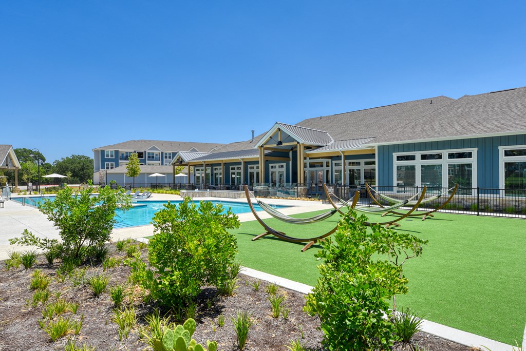 a large building with a pool in front of it at Estraya Boerne, Boerne, TX, 78006