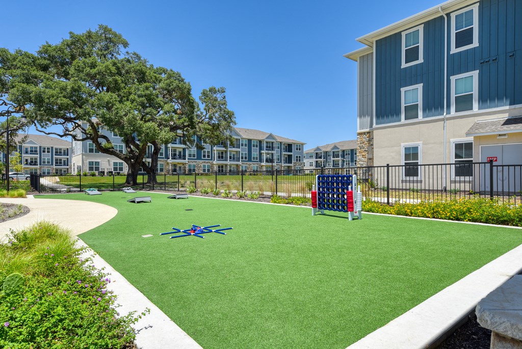 an image of a playground in front of an apartment building at Estraya Boerne, Texas, 78006