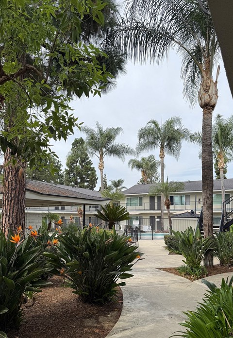 A building with a pool in front of it.