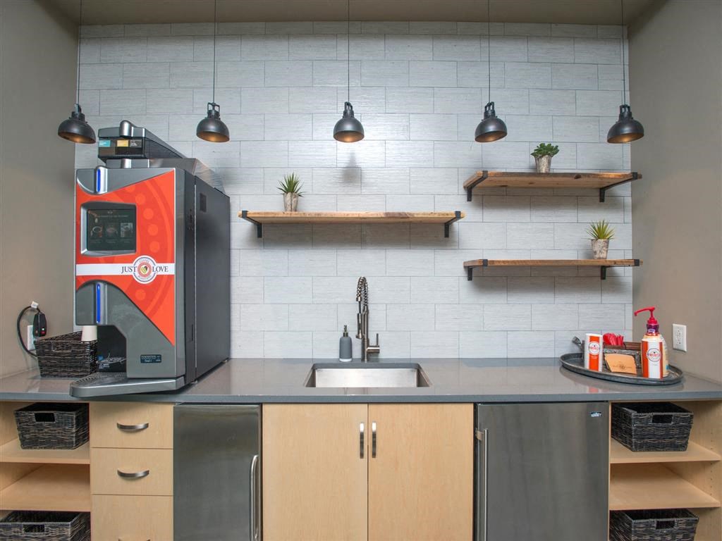 a kitchen with a coffee machine on the counter