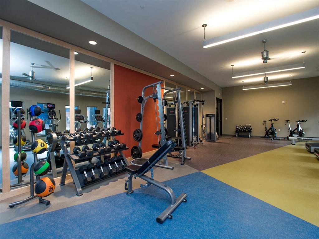 a gym with weights and other exercise equipment