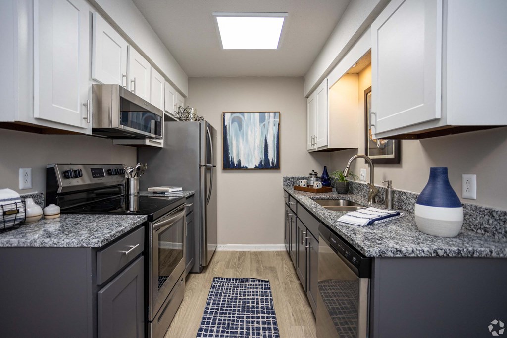 A kitchen with a refrigerator, oven, and microwave.at Addison at Sutherland, Knoxville, 37909  