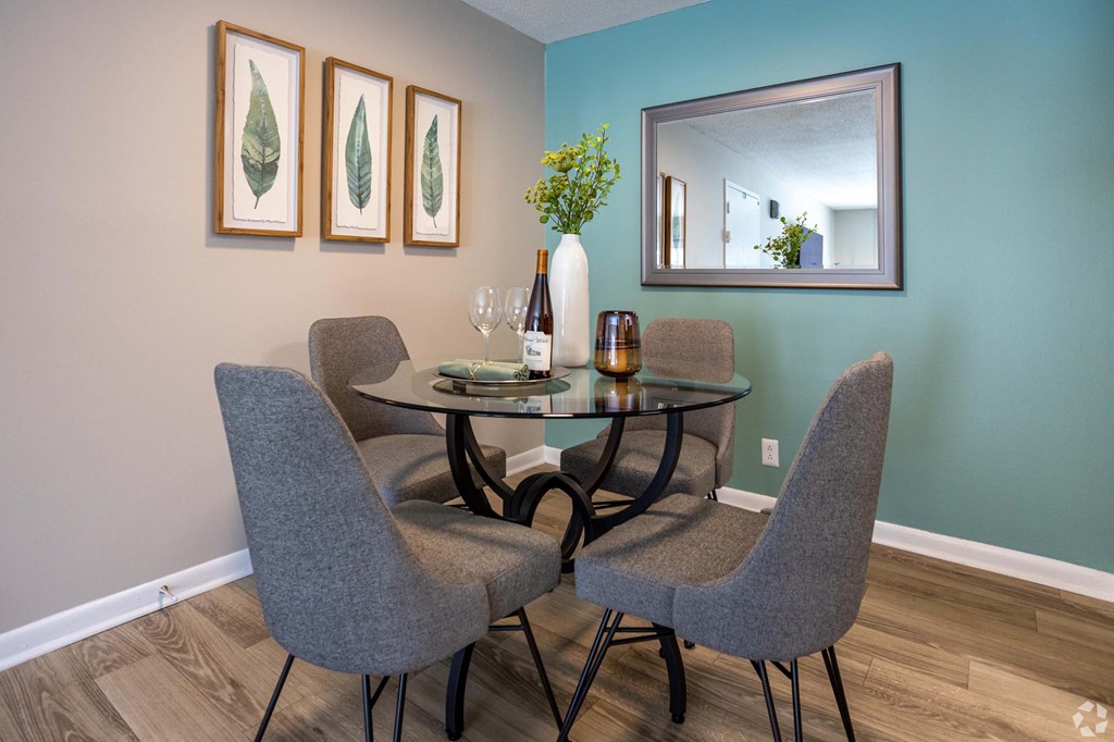 A dining room with a table and chairs. A dining room with a table and chairs.at Addison at Sutherland, Knoxville Tennessee