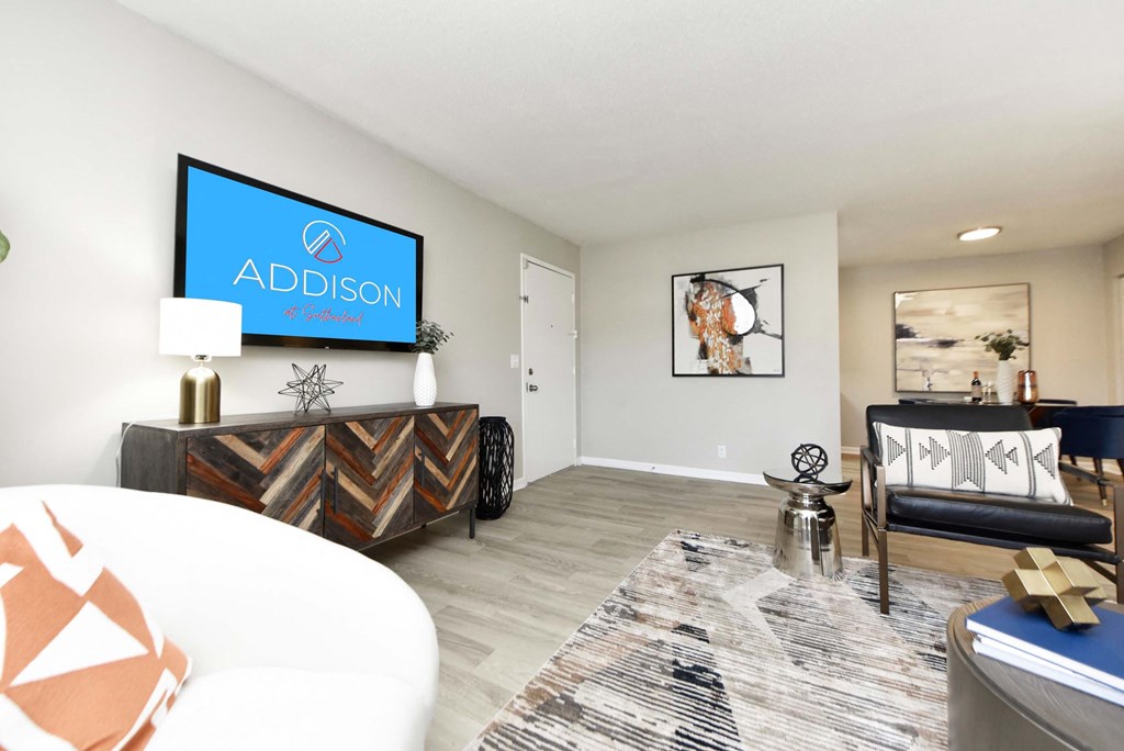 Living Room With TV at Addison at Sutherland, Tennessee