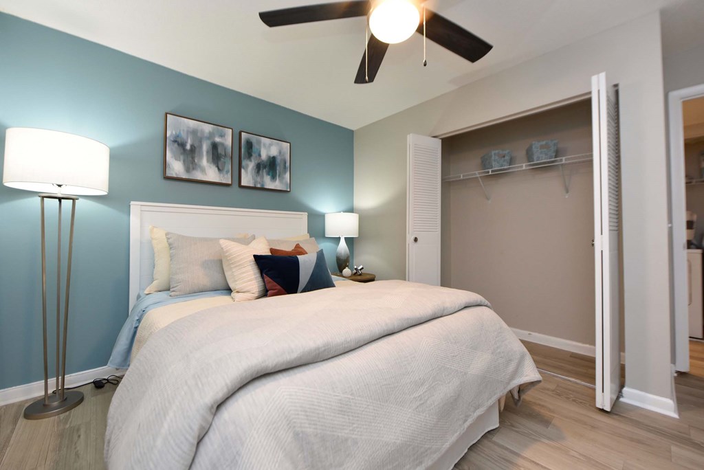 A bedroom with a large bed and a ceiling fan.at Addison at Sutherland, Tennessee, 37909