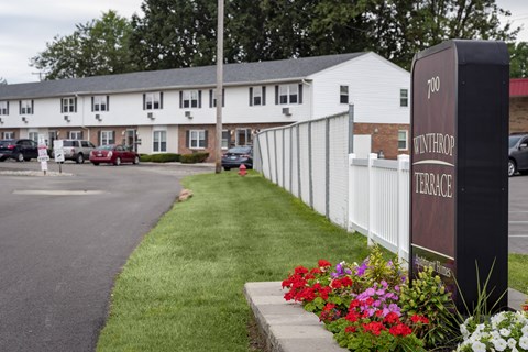 A sign that says Terrace in front of a building.