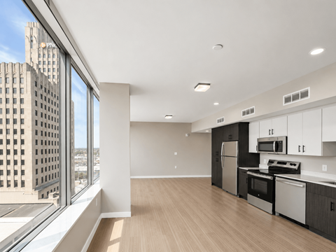 A modern kitchen with a view of the city.
