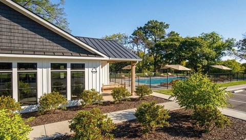 A modern house with a pool in the backyard.