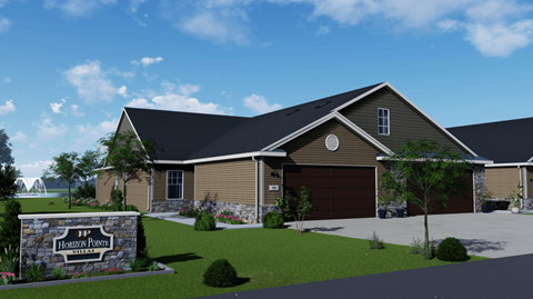A house with a sign that says Horizon Pointe in front of it.