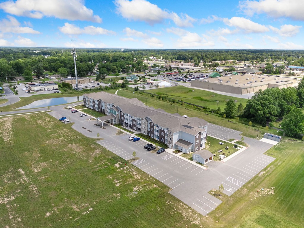 an aerial view of a city with buildings and a parking lot at 41 North Apartments, Indiana, 46835