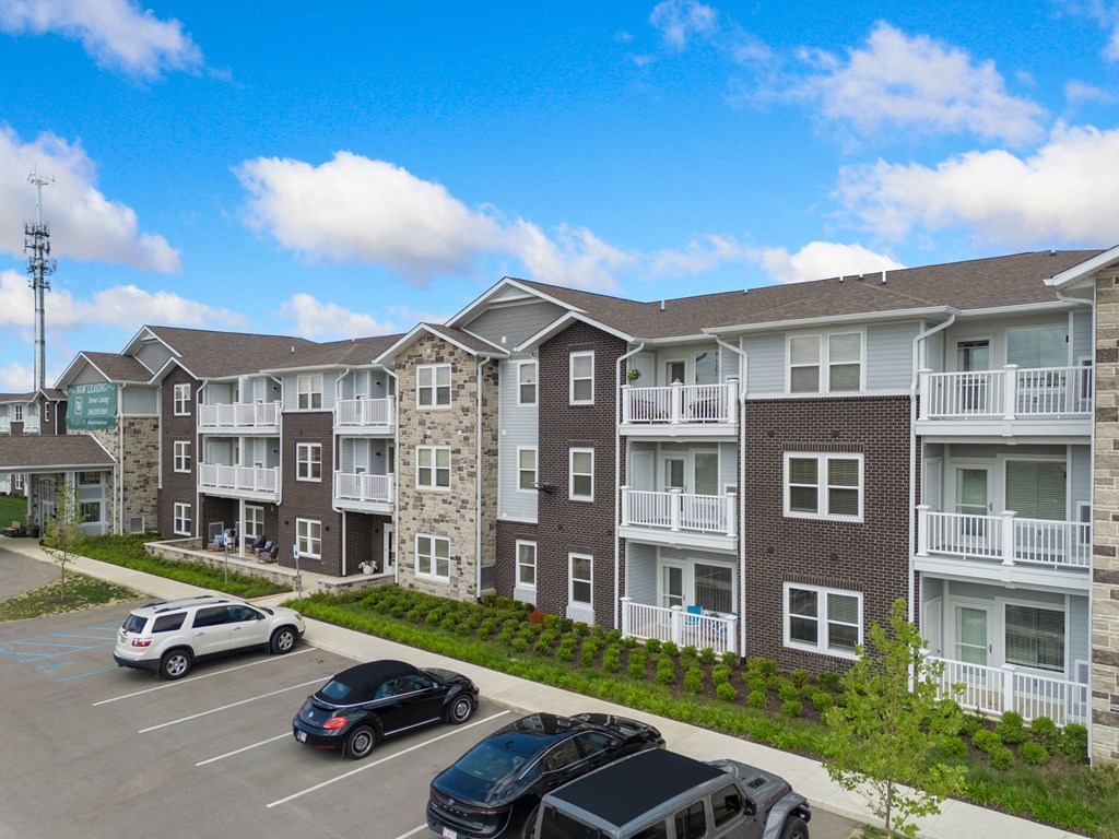 an aerial view of an apartment complex with cars in a parking lot at 41 North Apartments, Fort Wayne, IN 46835