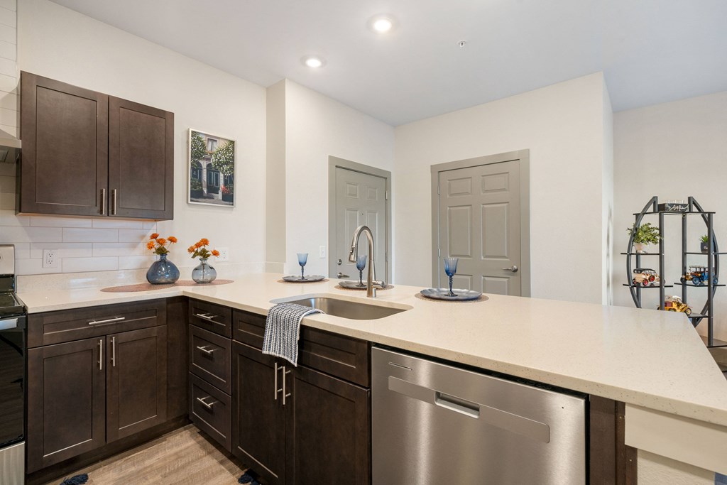 a kitchen with a large counter top and stainless steel appliances at 41 North Apartments, Fort Wayne Indiana