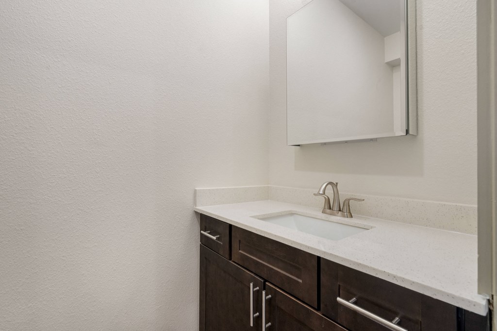 an empty bathroom with a sink and a mirror at 41 North Apartments, Indiana