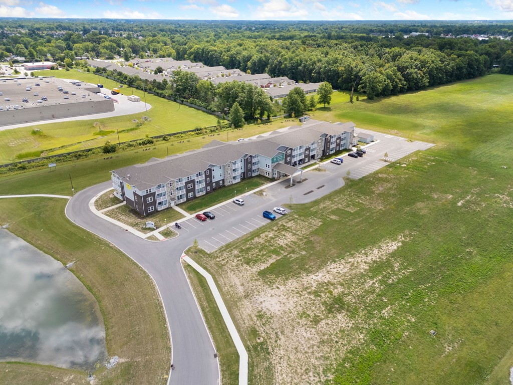 a view of a building from the air with a road and a parking lot at 41 North Apartments, Indiana, 46835