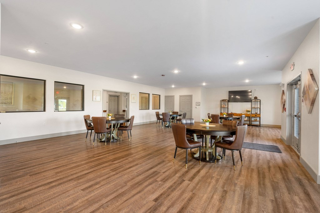 a large living room with a dining room table and chairs at 41 North Apartments, Fort Wayne, IN
