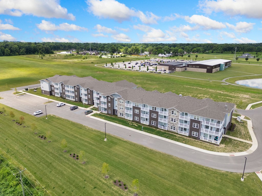 an aerial view of an apartment building next to a field at 41 North Apartments, Indiana, 46835
