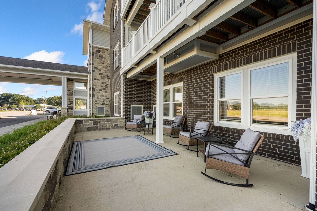 Balcony with chairs and a rug at 41 North Apartments, Fort Wayne