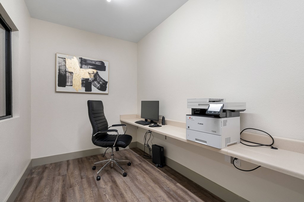 an office with a computer and a printer on a desk at 41 North Apartments, Fort Wayne Indiana