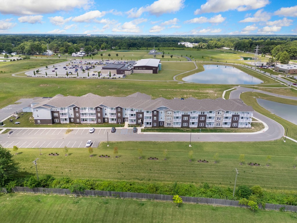 an aerial view of an apartment building next to a parking lot at 41 North Apartments, Fort Wayne, 46835