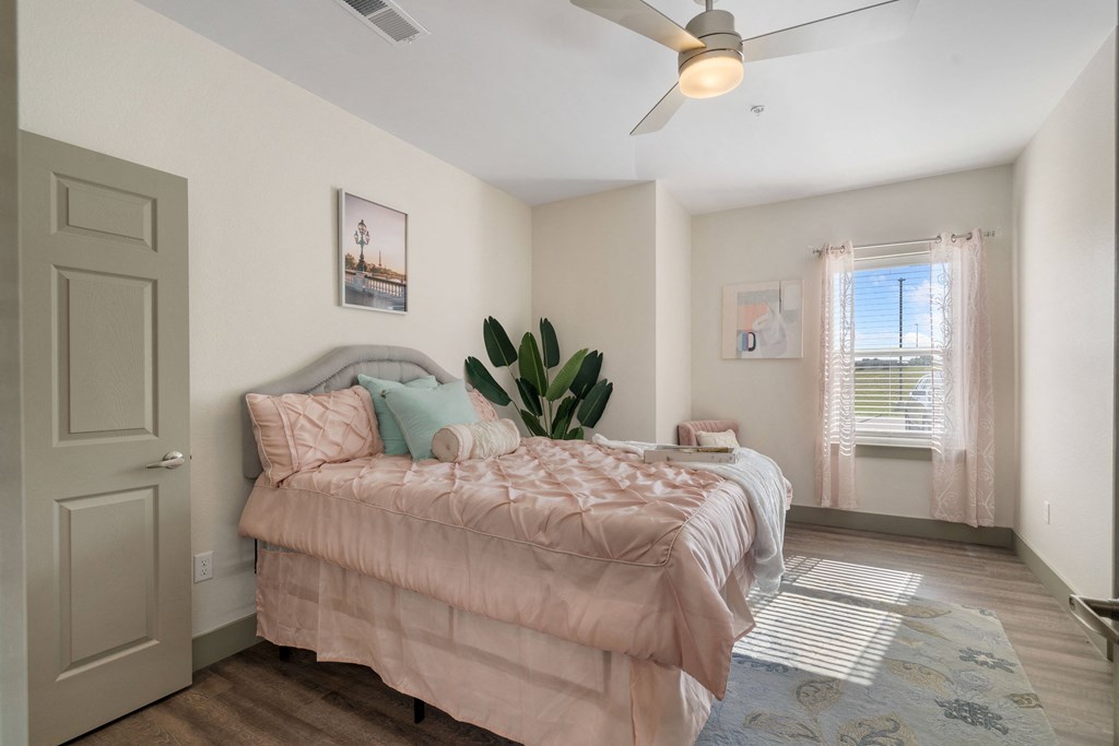 a bedroom with a bed and a ceiling fan at 41 North Apartments, Fort Wayne Indiana