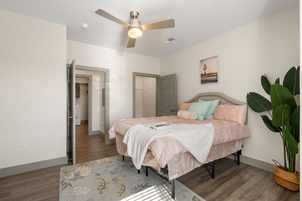 a bedroom with a large bed and a ceiling fan at 41 North Apartments, Fort Wayne Indiana