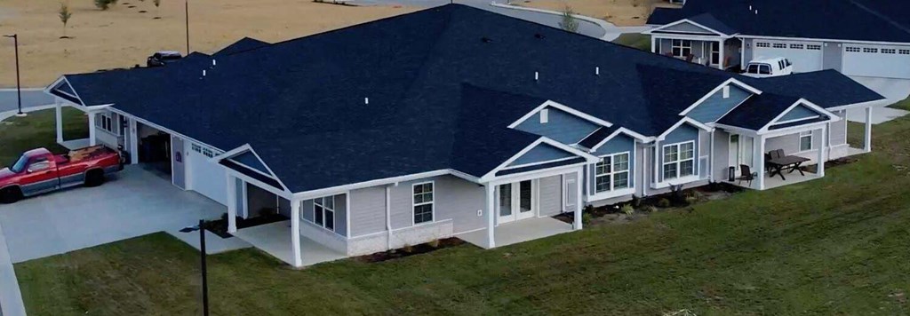 a house with a blue roof at Morada at Maysville, Fort Wayne