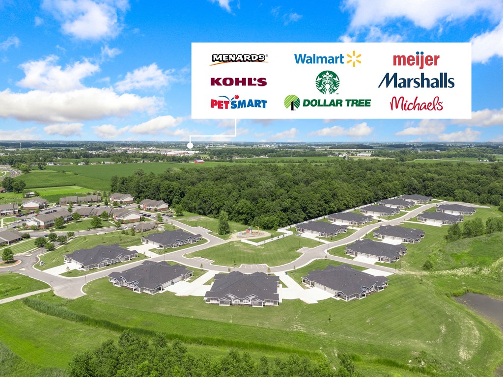 an aerial view of a residential neighborhood with a blue sky in the background at Morada at Maysville, Fort Wayne, IN 46815