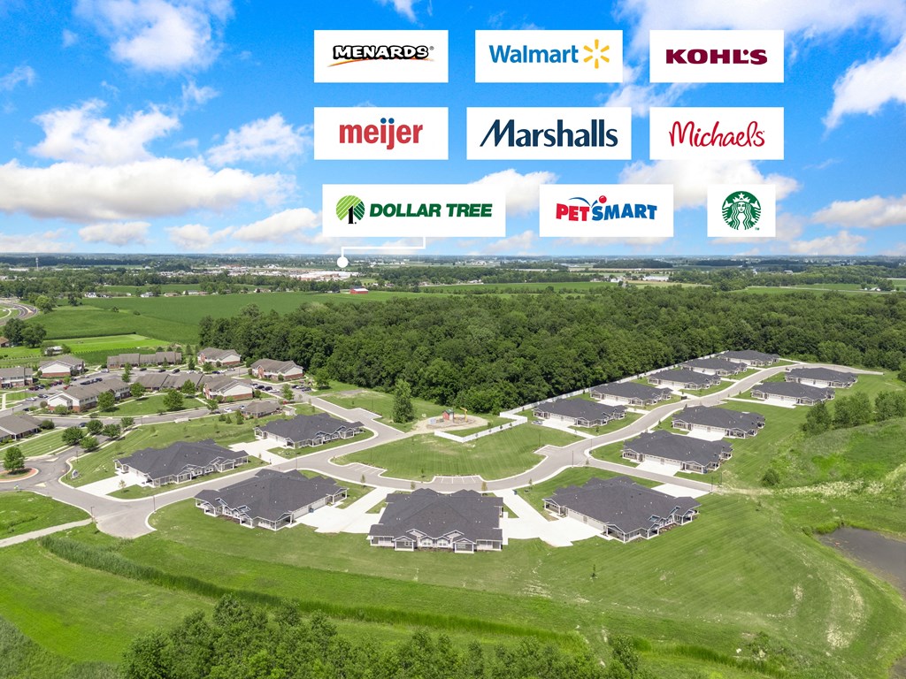 an aerial view of a neighborhood with many houses and trees at Morada at Maysville, Indiana, 46815
