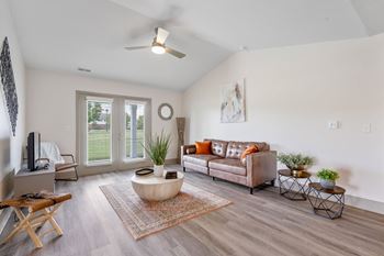a living room with a couch and a coffee table at Morada at Maysville Apartments, Fort Wayne, IN, 46815