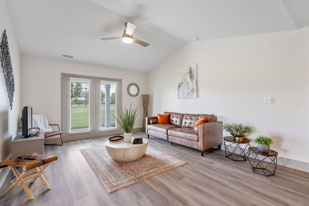a living room with a couch and a coffee table at Morada at Maysville, Fort Wayne, IN 46815