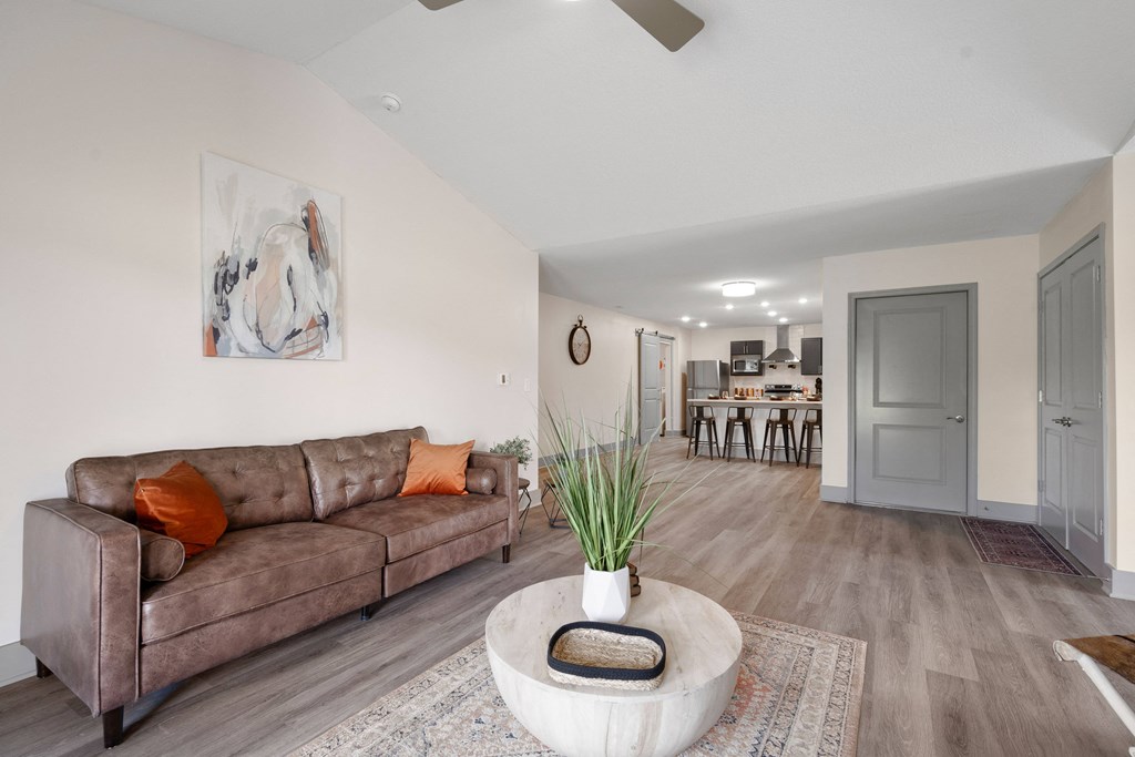 a living room with a couch and a coffee table at Morada at Maysville, Fort Wayne, 46815