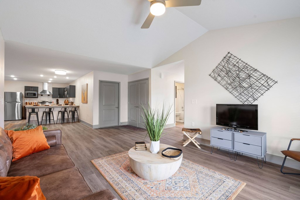 a living room with a couch and a tv at Morada at Maysville, Fort Wayne