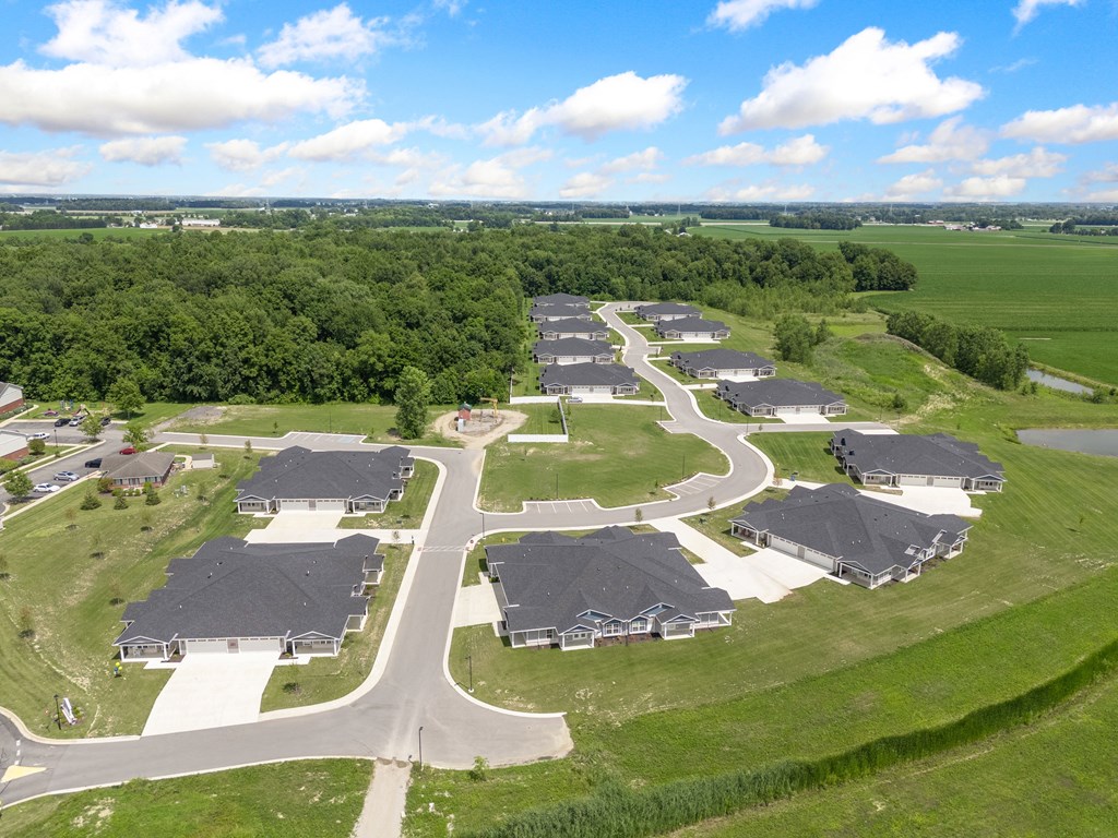 an aerial view of a neighborhood of houses with cars parked at Morada at Maysville, Indiana