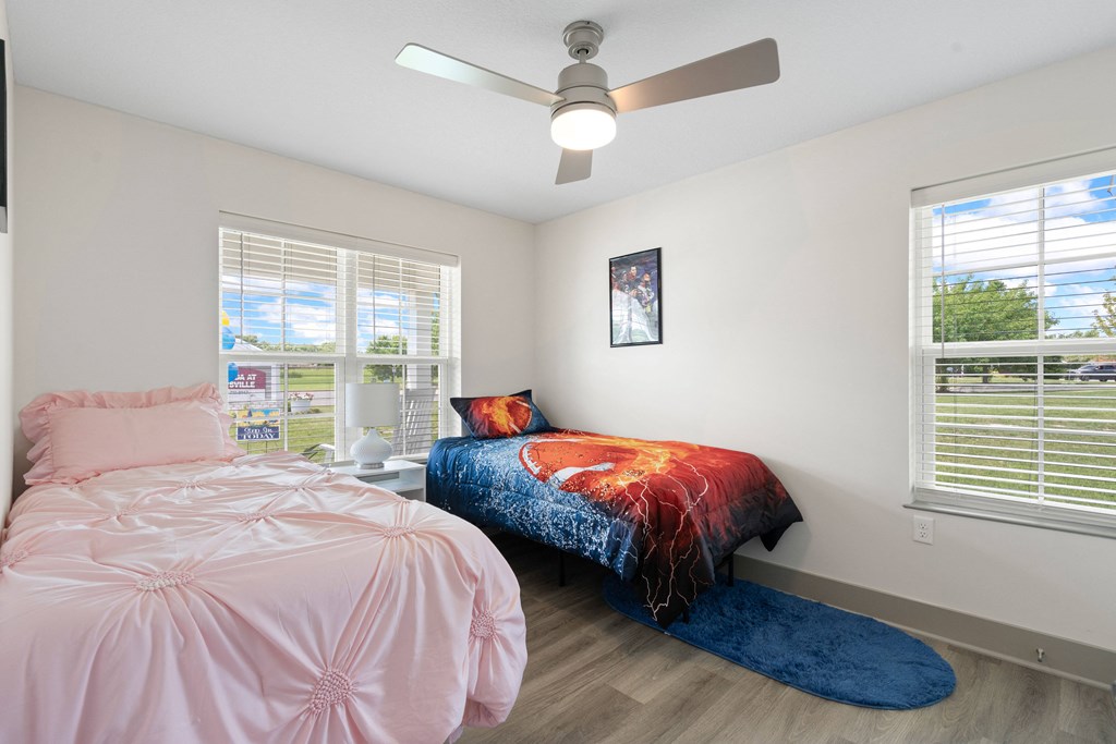 a bedroom with a bed and a ceiling fan at Morada at Maysville, Fort Wayne Indiana