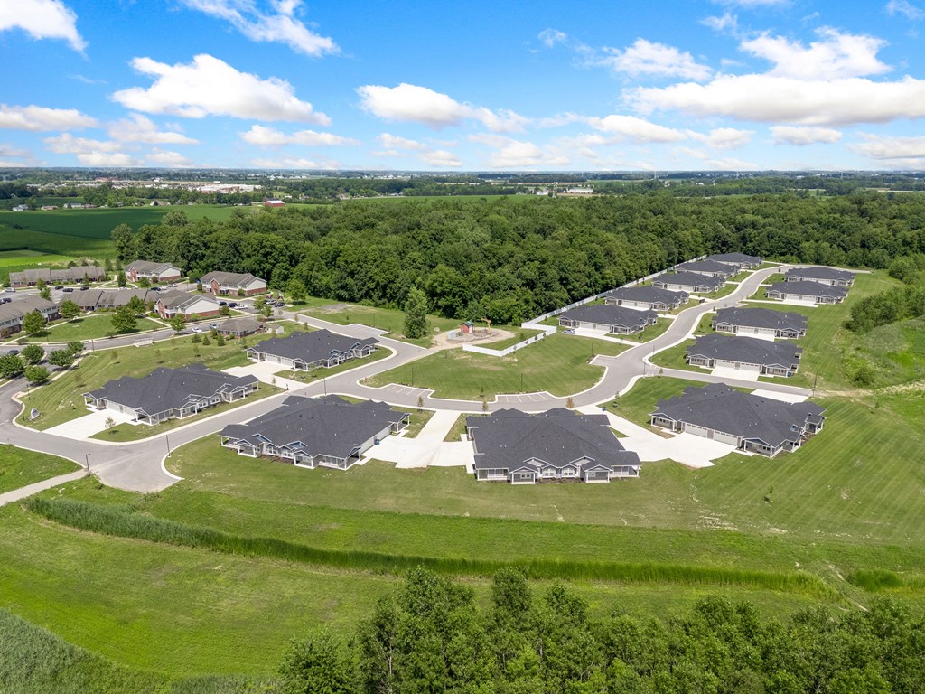 an aerial view of a neighborhood of houses and a field at Morada at Maysville, Fort Wayne Indiana