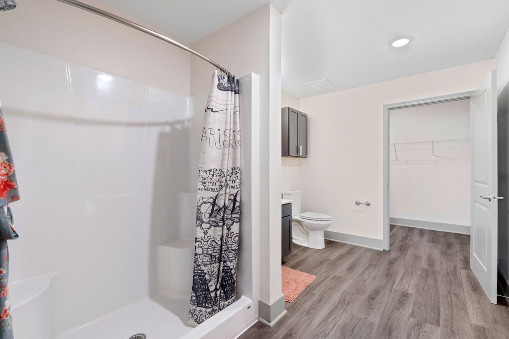 a bathroom with a shower and a toilet and a sink at Morada at Maysville, Indiana