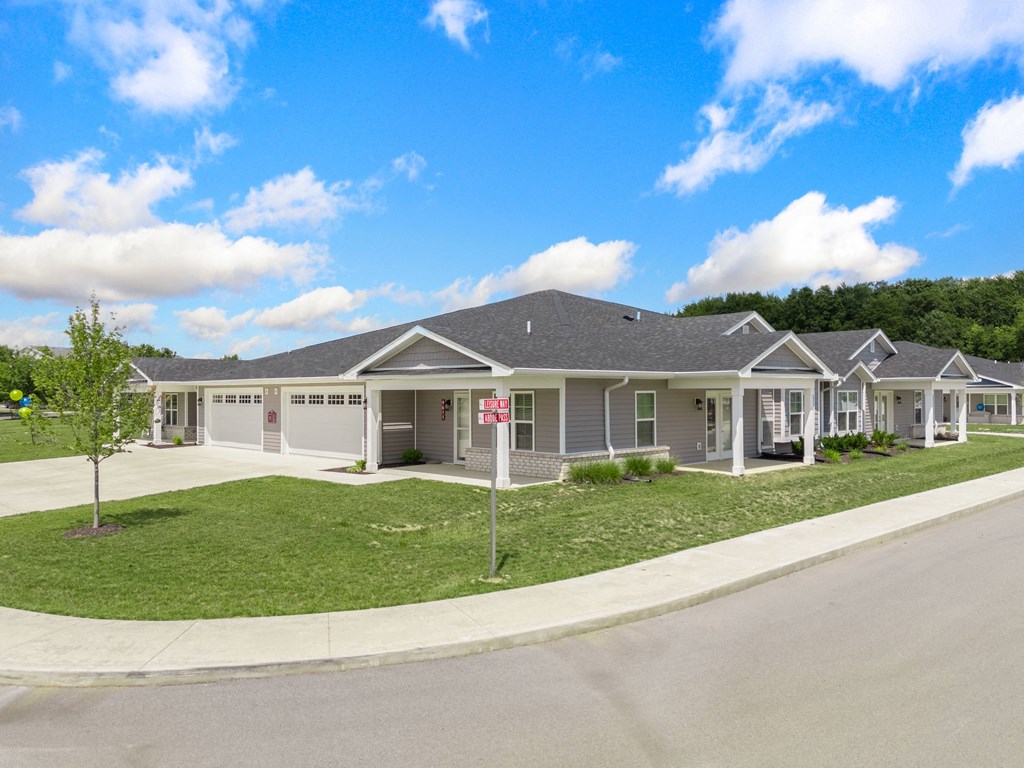a house with a lawn and a street in front of it at Morada at Maysville, Fort Wayne, 46815