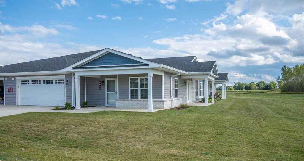 a house with a lawn in front of it at Morada at Maysville, Fort Wayne Indiana
